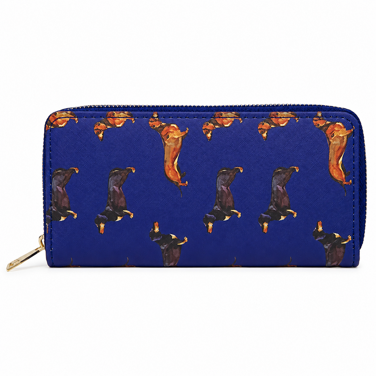 A zip-around wallet with a textured royal blue background, featuring a repeating pattern of Dachshund dogs. A gold-tone zipper pull is visible on the lower left, and the wallet is photographed against a plain white background.