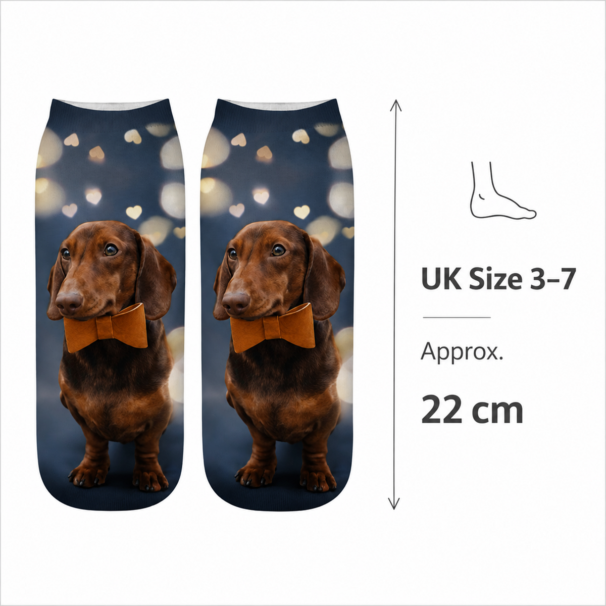 A pair of printed ankle socks shown on a white background with size information. The socks feature a brown dachshund wearing an orange bow tie against a dark blue bokeh background.