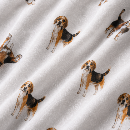 White fabric with a repeating print of beagle dogs in tan, brown, and black, with a subtle light gray swirl pattern in the background.