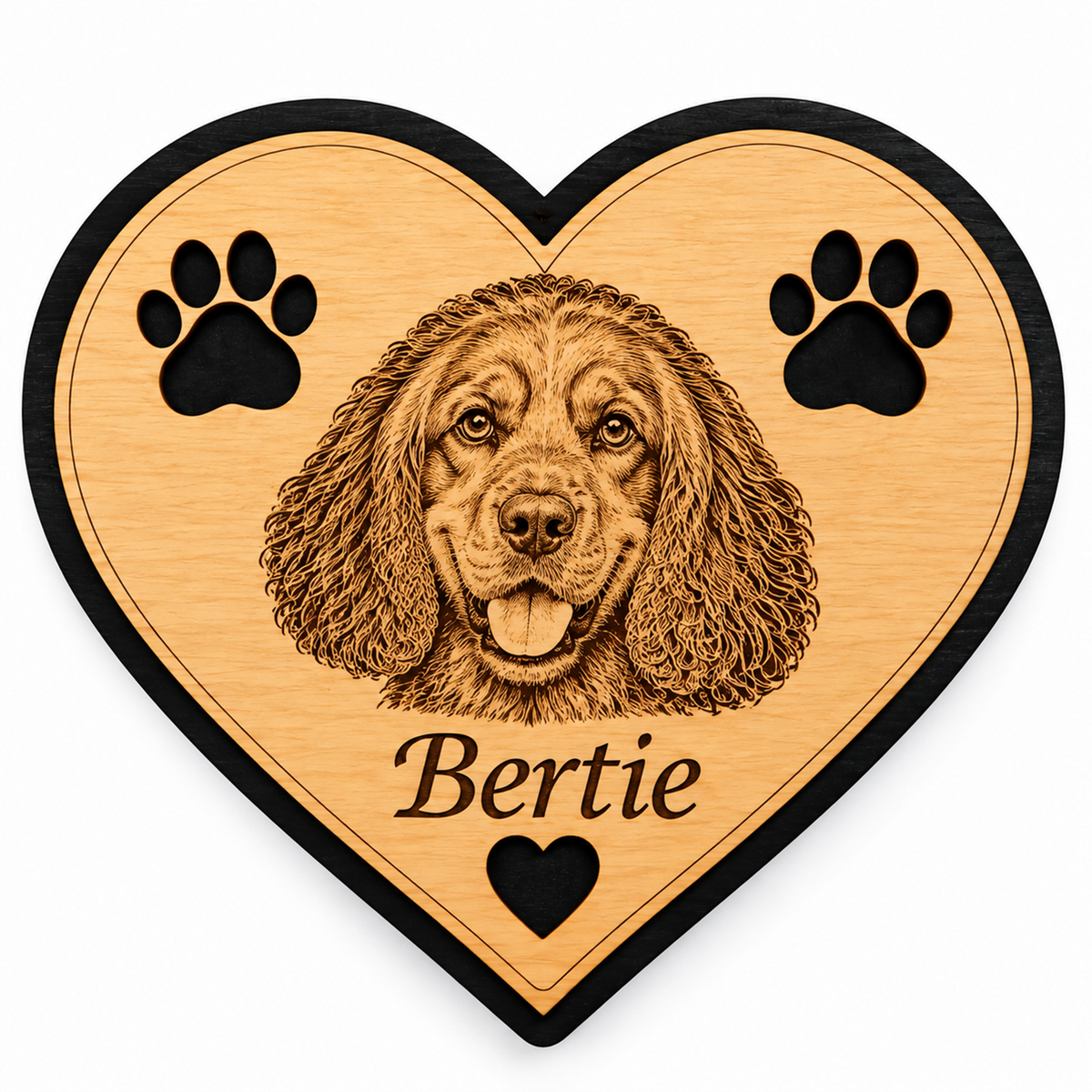 Personalised wooden heart fridge magnet featuring an engraved dog's face, paw prints and the name Bertie, with natural wood finish and black border.