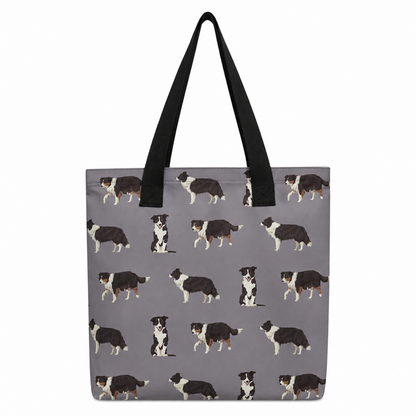 A grey tote bag with black shoulder straps, featuring an all-over repeating pattern of black, white, and tan dog illustrations, shown against a plain white background.
