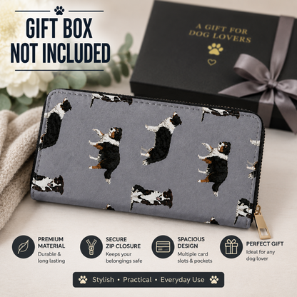 A grey zip-around wallet with a black-and-white Border Collie dog print pattern, shown on a soft beige surface with a black gift box and the text 'GIFT BOX NOT INCLUDED.' Infographic callouts around the wallet highlight premium material, secure zip closure, spacious design, and gift-friendly styling.