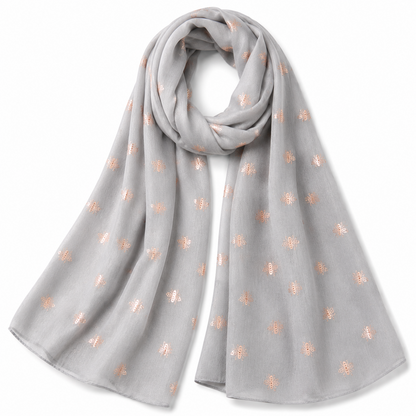 A light grey scarf with small rose gold embroidered bumblebee motifs, draped in a loop on a white background.