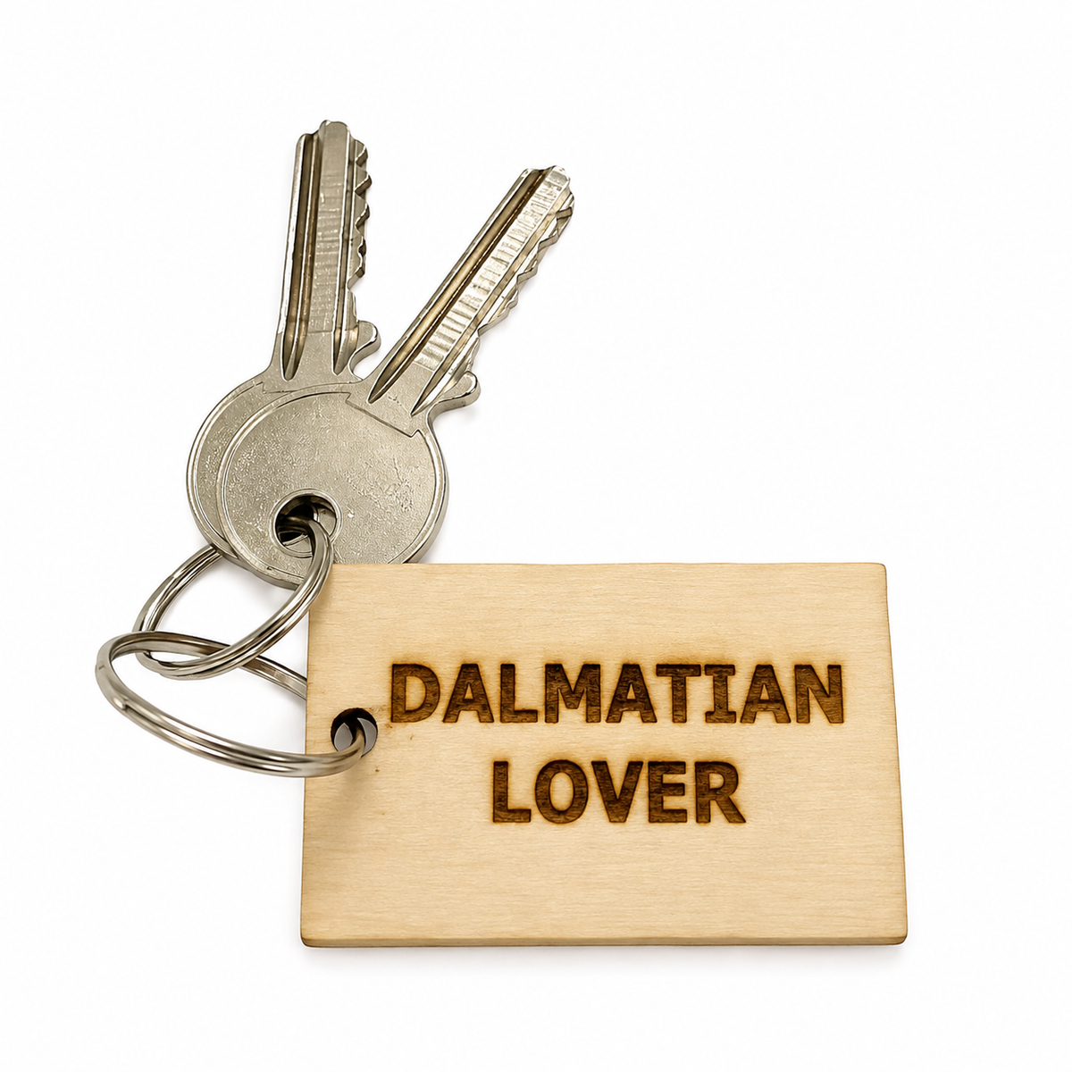 A wooden key tag engraved with 'DALMATIAN LOVER' in dark brown lettering, attached to a silver metal keyring with two keys, shown on a plain white background.