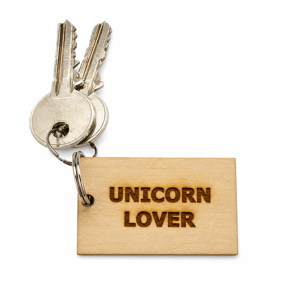A wooden keychain tag engraved with 'UNICORN LOVER' in dark brown lettering, attached to a metal keyring with two silver keys, shown on a plain white background.