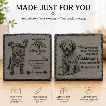 Two engraved slate pet memorial coasters displayed on a wooden surface, with the text 'MADE JUST FOR YOUR' above and feature icons below. The left coaster shows a dog illustration with a personalized message, and the right coaster shows a dog sitting with paw prints and the words 'Always proud to be the most important Passenger family member Love Elcia'.