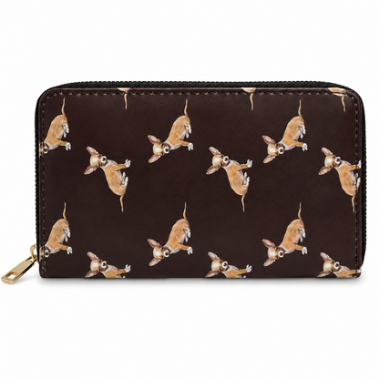 A black zip-around wallet with an all over print of Chihuahua dogs in tan, brown, and white, shown on a plain white background.