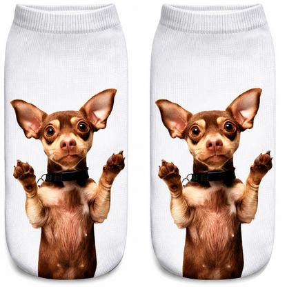 A pair of white ankle socks featuring a printed graphic of a brown and cream Chihuahua dog with its paws raised, shown against a plain white background.