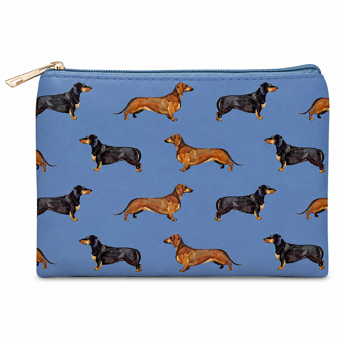 A blue zipped cosmetic bag featuring a repeating pattern of dachshund dogs in black and tan, with a gold zipper pull, shown on a plain white background.