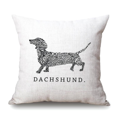 Cream pillow cushion cover with black dachshund illustration and text on a white background