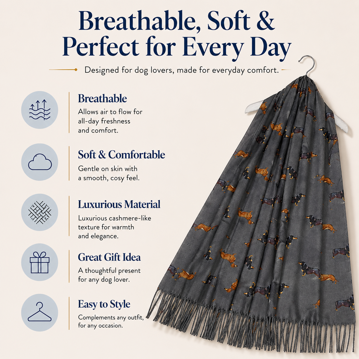 A dark grey dog scarf with a pattern of dachshund sausage dogs and tassels, hanging on a hanger against a light beige background with product feature text and icons.