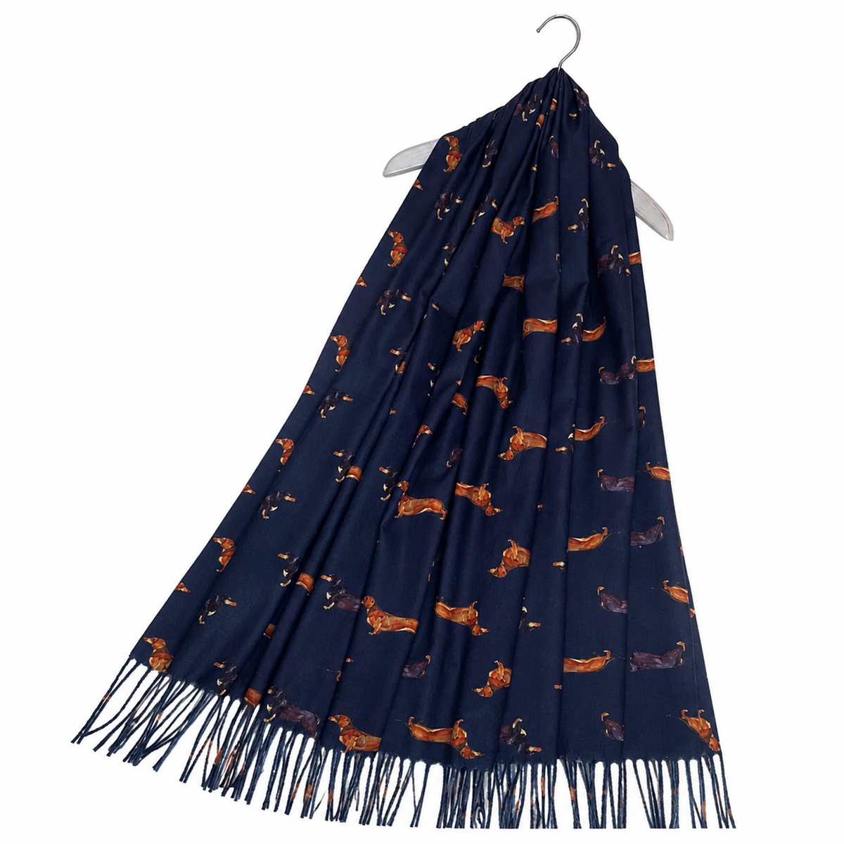 A navy blue scarf with an all-over dachshund print, hanging on a white hanger against a plain white background. The scarf features fringe along the bottom edge.