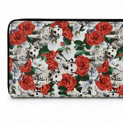 A zip-around wallet featuring a repeating pattern of Dalmatian puppies and red roses on a white background, with a black zipper.