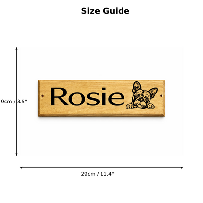 A size guide diagram showing a rectangular wooden kennel door sign with the name 'Rosie' and a French bulldog illustration. Black dimension arrows indicate the sign is 9cm by 29cm (3.
