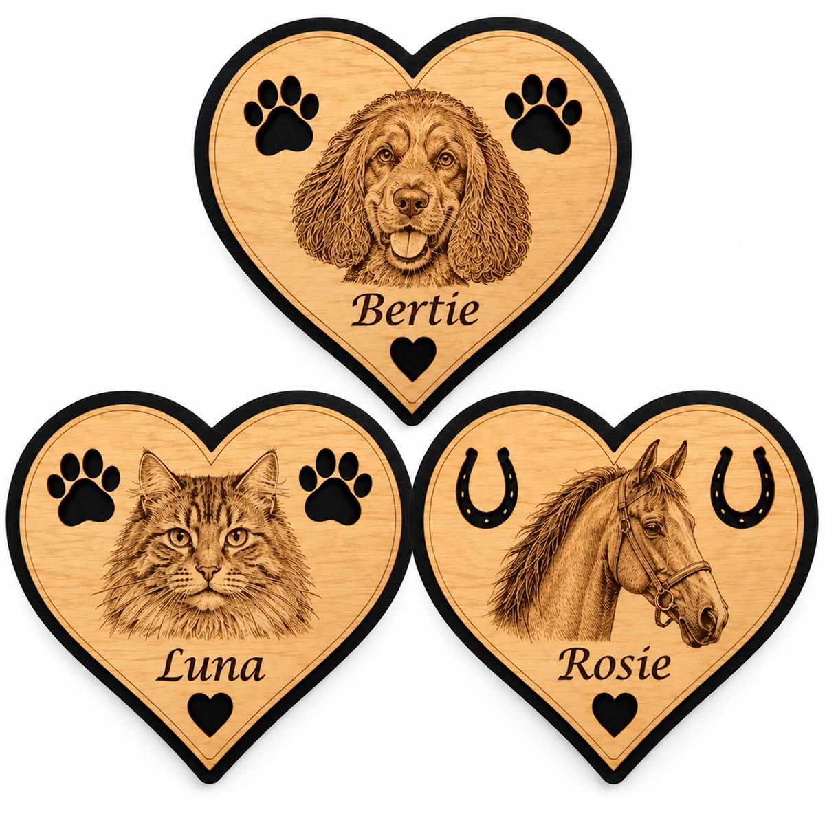 Personalised wooden heart fridge magnets featuring an engraved pet's faces with natural wood finish and black border.
