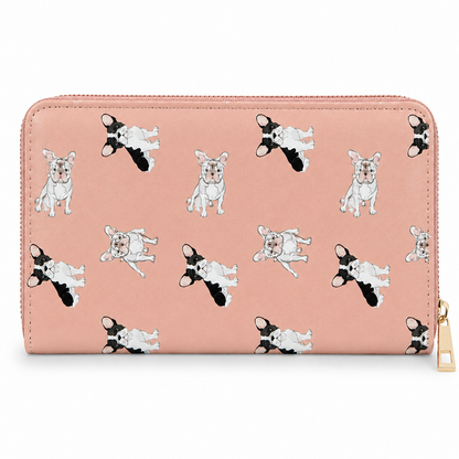 A pink zip-around wallet with a repeating pattern of illustrated French Bulldog puppies in black, white, and pink, shown on a clean white background with a gold zipper pull.