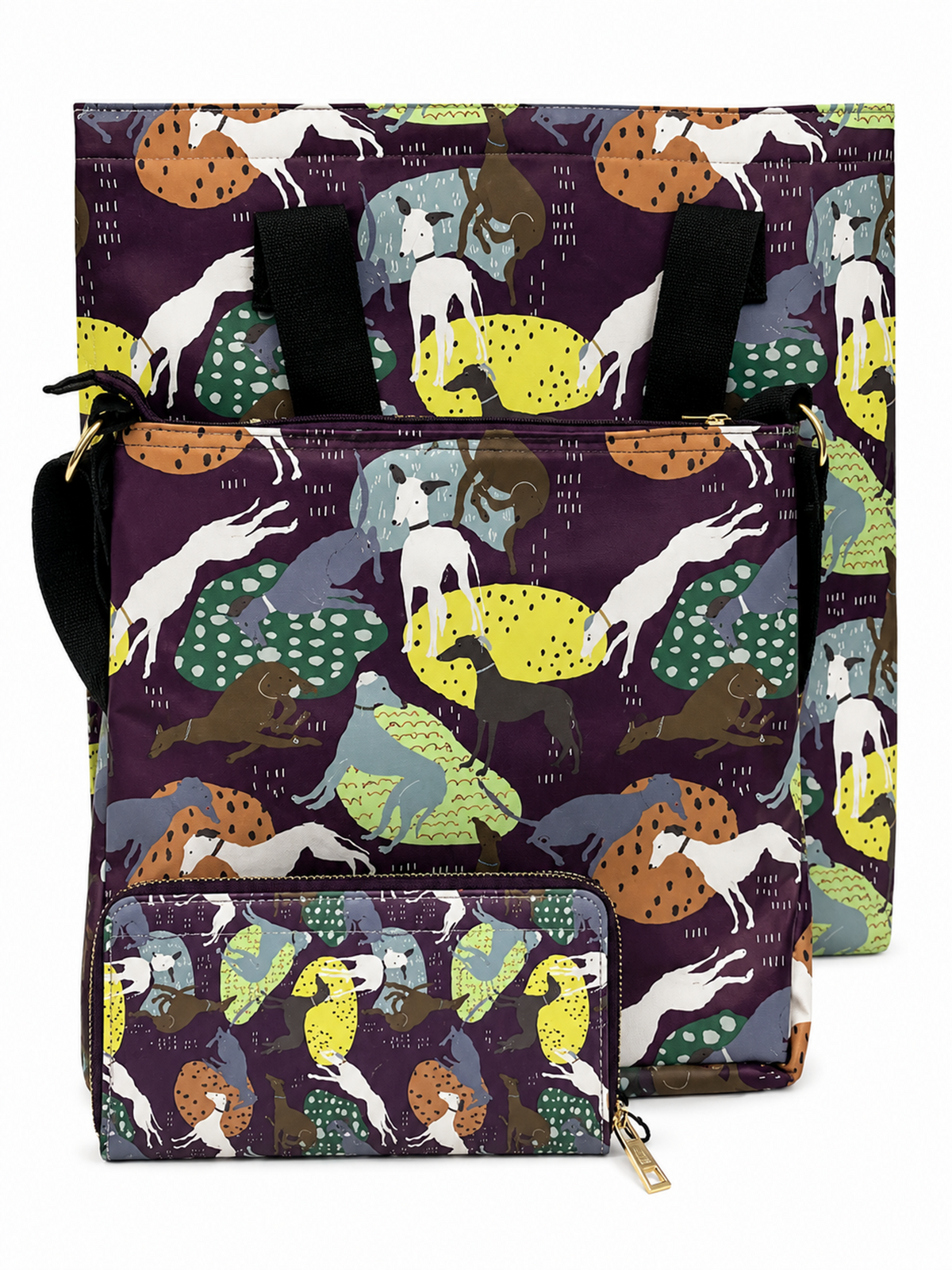 A matching greyhound dog-themed backpack and tote bag set with a dark purple background and a colourful pattern of various dog breeds in white, yellow, green, brown, and orange. The tote bag is positioned behind the backpack, showing its black handles and zipper closure.