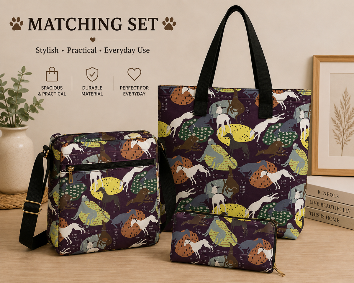 A matching set of three Greyhound Whippet dog-themed tote and crossbody bags displayed on a tabletop with decorative props. The set includes a large tote bag, a medium crossbody bag, and a small zip pouch, all featuring a dark purple background with a whimsical print of dogs in yellow, green, brown, and white, along with trees and foliage.