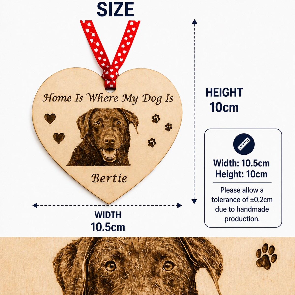 Personalized wooden heart dog memorial plaque with engraved dog portrait, paw prints, and the text 'Home Is Where My Dog Is' and 'Bertie', shown with size annotations: 10cm height and 10.5cm width, plus a red-and-white polka dot hanging ribbon.