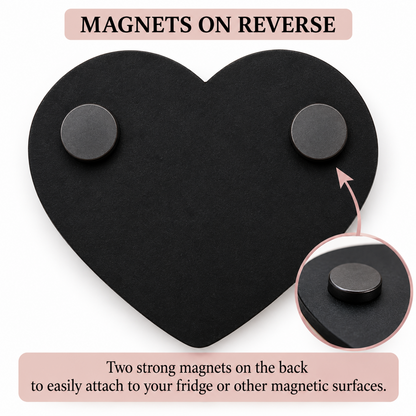 Black heart-shaped magnetic display board with two round magnets on the back, shown on a white background with text explaining that magnets are on reverse and a circular inset close-up of one magnet.
