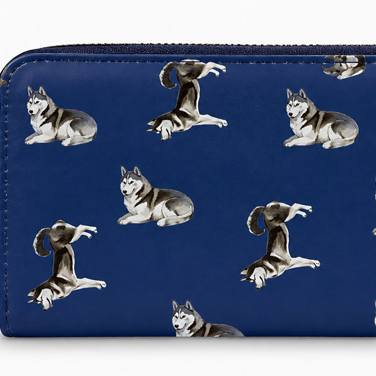 A blue zip-around wallet featuring a repeating pattern of gray and white Siberian husky dogs in various poses, shown against a plain white background.