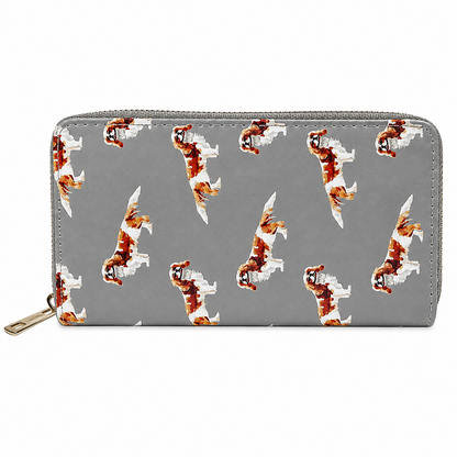 A grey zip-around wallet with a repeating pattern of brown and white King Charles Cavalier Spaniel dog illustrations, shown on a plain white background.