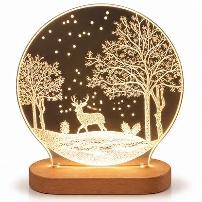 A round illuminated LED night light with an etched winter forest scene featuring a stag, trees, and stars, mounted on a wooden base.