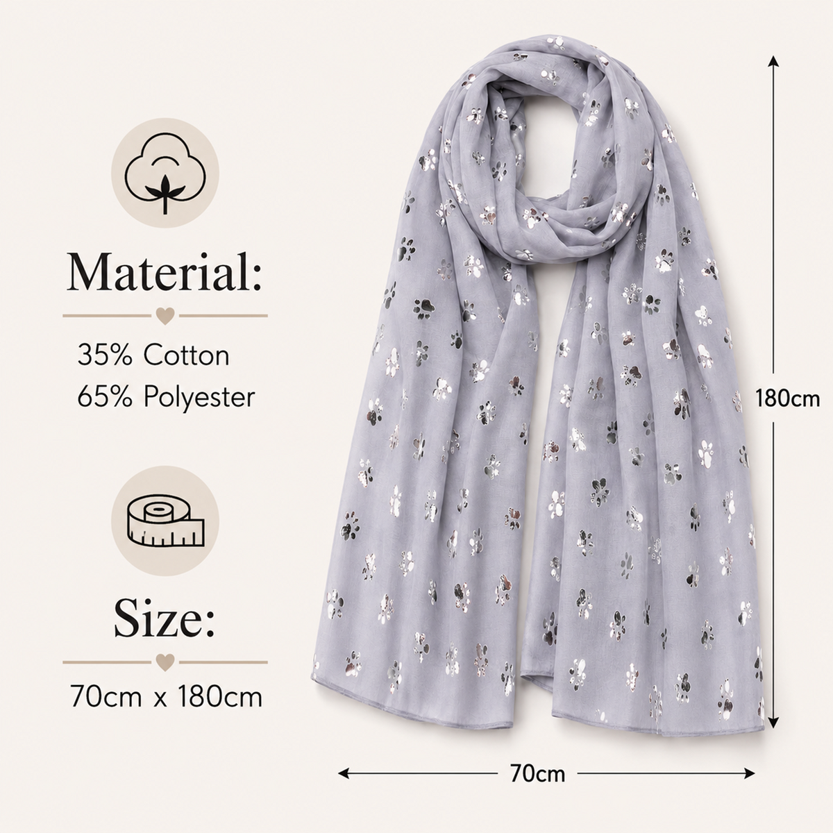 A light grey scarf with a small metallic silver paw print pattern, shown with dimension lines and text detailing its material composition (Cotton, Polyester) and size (70cm x 180cm).