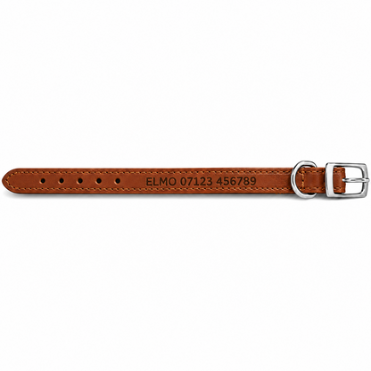A brown leather watch strap with silver-tone hardware, featuring custom engraved text 'ELMO 07123 456789' on the inner side, displayed against a solid white background.