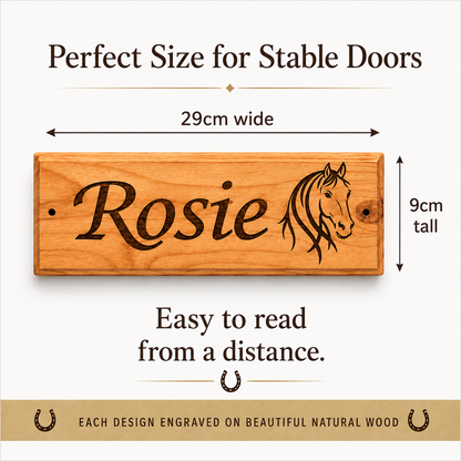 A wooden stable door sign engraved with the name 'Rosie' and a horse head illustration, shown with dimension arrows indicating 29cm wide by 9cm tall. Text above and below says it is perfect size for stable doors and easy to read from a distance.