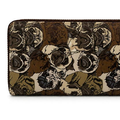 A zip-around wallet featuring an all-over illustrated pattern of pug dog faces in shades of brown, beige, black, and olive green, shown against a plain white background.