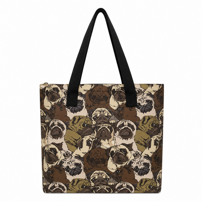 A tote bag featuring an all-over print of pug dog faces in shades of brown, beige, and olive green, with solid black shoulder straps, shown against a plain white background.