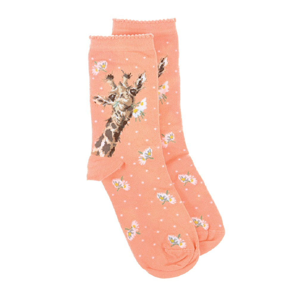 Peach-colored socks with a giraffe design on a white background