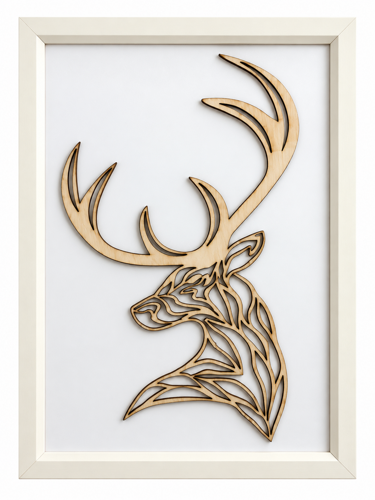 Laser-cut wooden stag head wall art with antlers, displayed in a white frame against a white background.