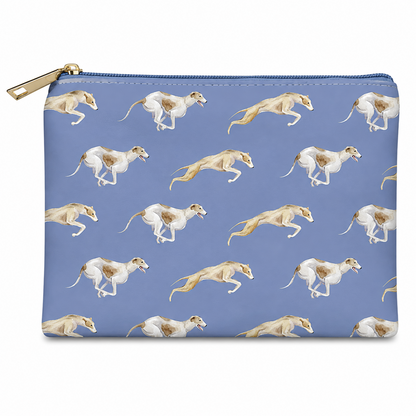 A rectangular zip cosmetic bag with a gold zipper and pull, featuring a repeating pattern of running greyhounds on a dusty blue background.