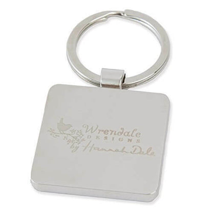 A silver square metal keychain with a circular split ring, featuring an engraved design that reads 'Wrendale DESIGNS by Hannah Dale' with a small bird and floral motif, shown on a plain white background.