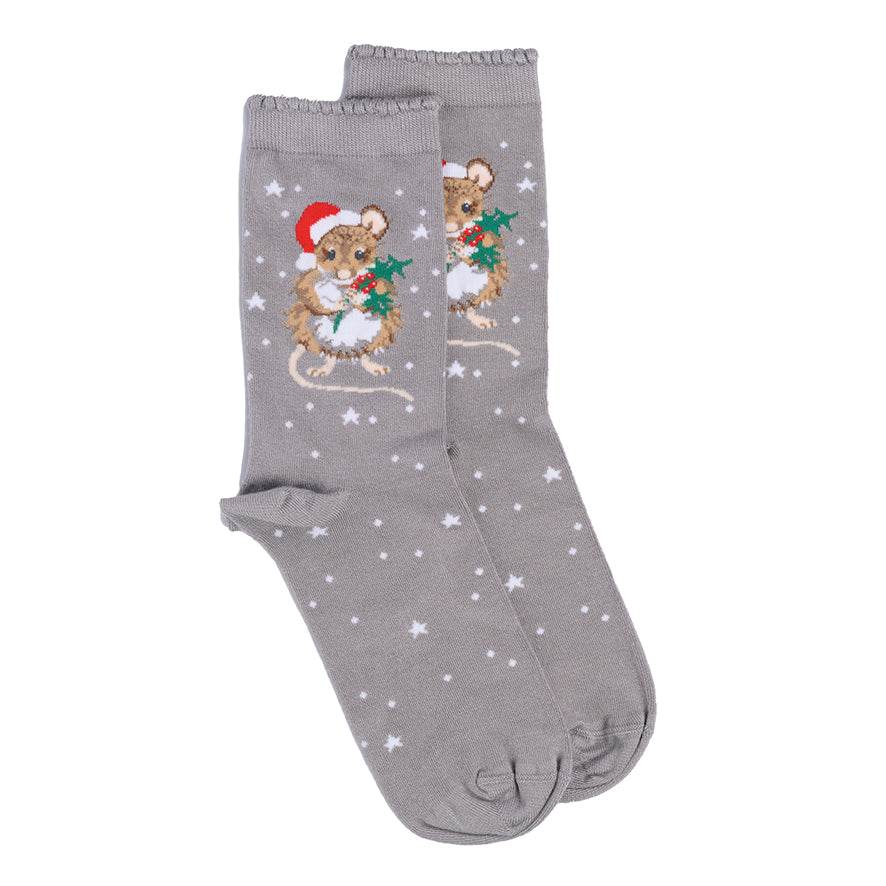 A pair of grey crew socks featuring a festive Christmas design with embroidered mice wearing red Santa hats and holding green holly, set against a background of white stars.