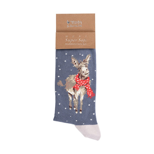 A single Christmas-themed sock in grey  with a white star pattern, featuring a beige donkey wearing a red polka-dot scarf. The sock is displayed on its brown kraft paper packaging header card, which reads 'Mens Super Soft Bamboo Socks' and shows the brand 'Wrendale Designs' by Hannah Dale.