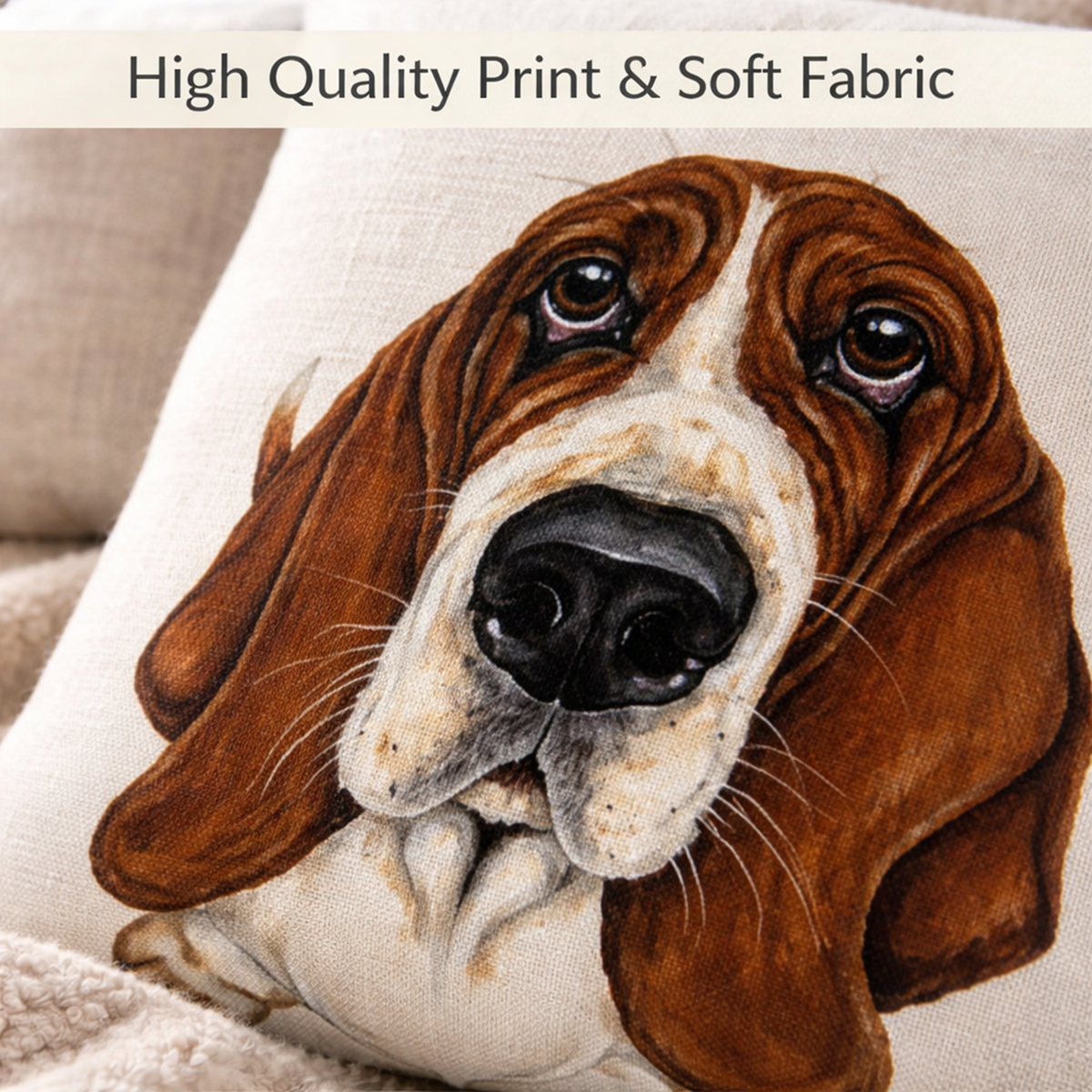 A close-up of a decorative cushion cover featuring a realistic printed portrait of a basset hound. The pillow is made of soft beige fabric, and a beige banner at the top reads 'High Quality Print & Soft Fabric'.