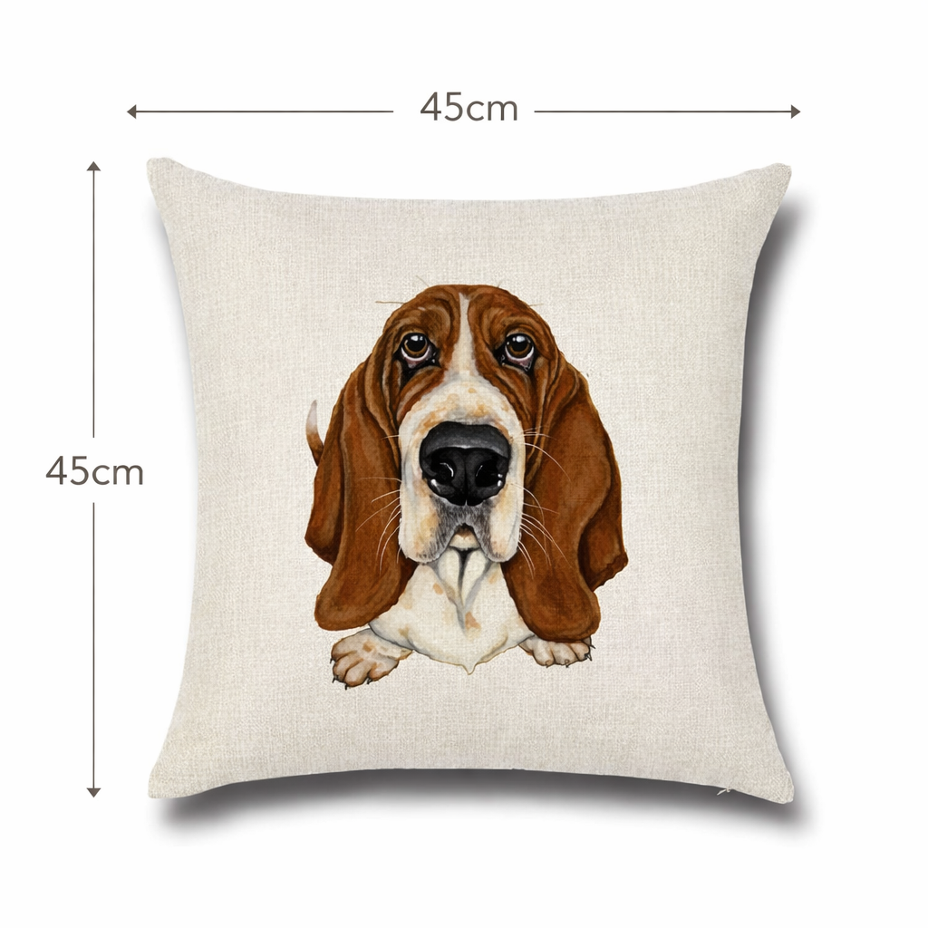 A square beige cushion cover with a printed illustration of a brown and white basset hound face, shown with dimension lines indicating a 45cm by 45cm size.