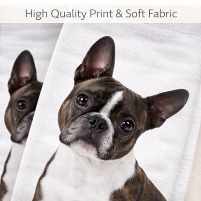 A close-up of a white sock, printed with a Boston Terrier dog. A second, smaller duplicate dog print is visible in the background.