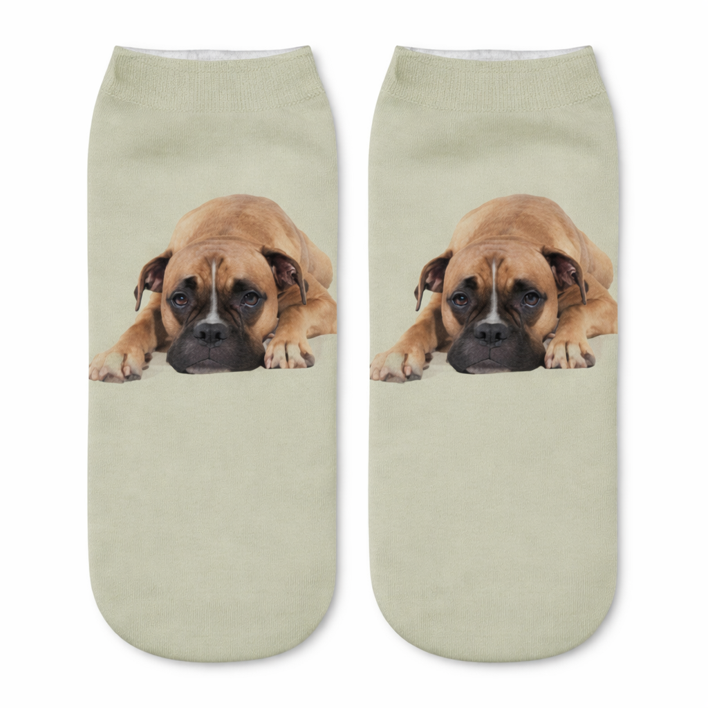 Pair of socks with a dog print on a sage green background