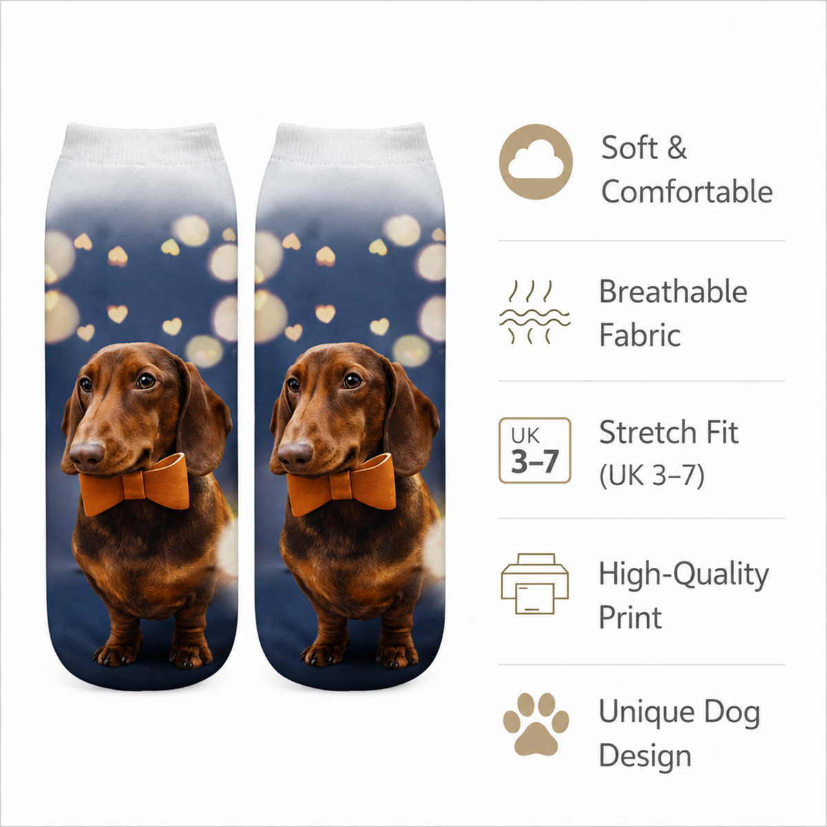 A pair of ankle socks with a printed design of a brown dachshund wearing an orange bow tie against a dark blue background with small heart bokeh lights. The image includes a feature list on the right with icons and text: Soft & Comfortable, Breathable Fabric, Stretch Fit (UK 3-7), High-Quality Print, and Unique Dog Design.