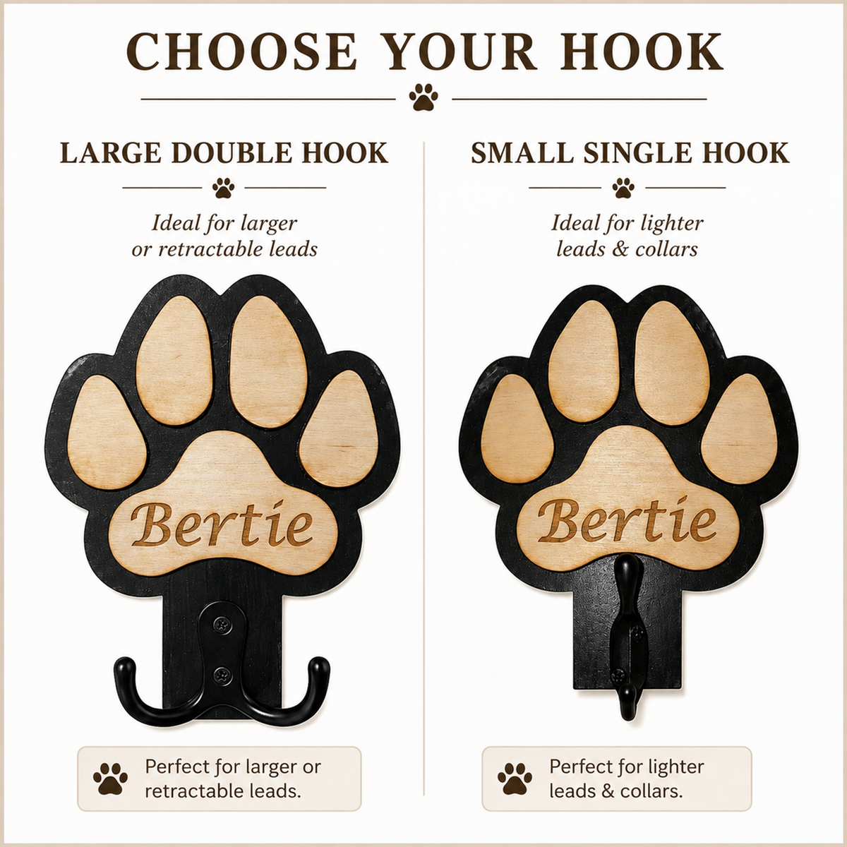 A product comparison graphic showing two versions of a paw-shaped pet name dog lead holder: a large double hook labelled 'LARGE DOUBLE HOOK' and a small single hook labelled 'SMALL SINGLE HOOK.' Both hooks have a black metal frame and a light natural wood paw pad with the name 'Bertie' engraved.