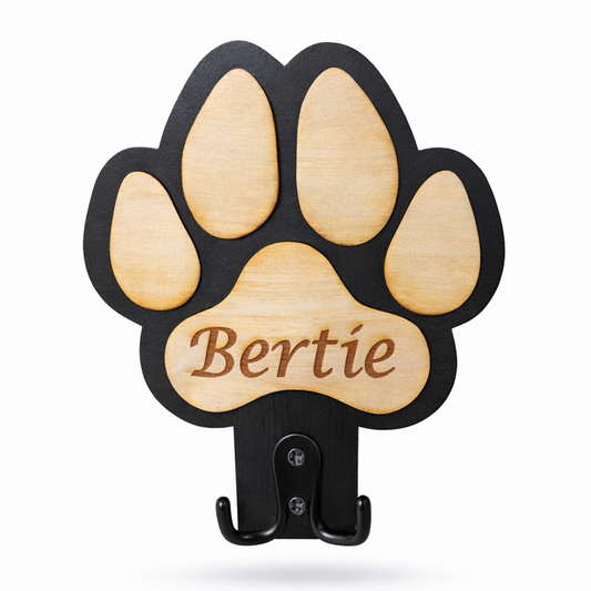 Wooden paw-shaped dog lead holder plaque with 'Bertie' engraved on a white background