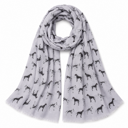 A light grey scarf with an allover print of black and white Great Dane dog silhouettes, draped in a loop on a white background.