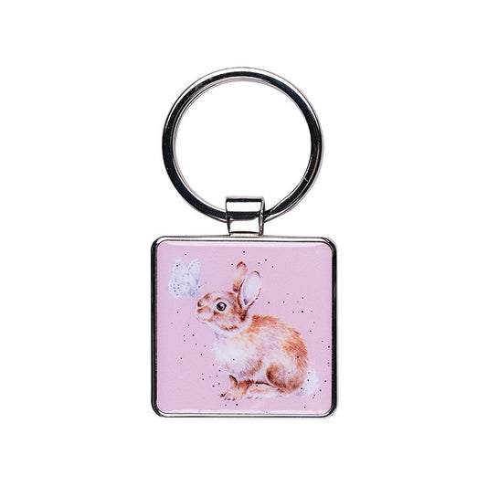 Keychain with a rabbit design on a pink background