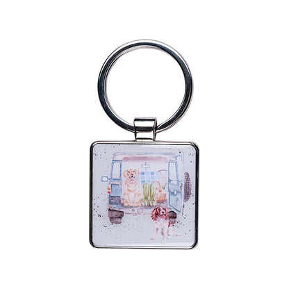 Keychain with a design of a dog and a child in a room on a white background