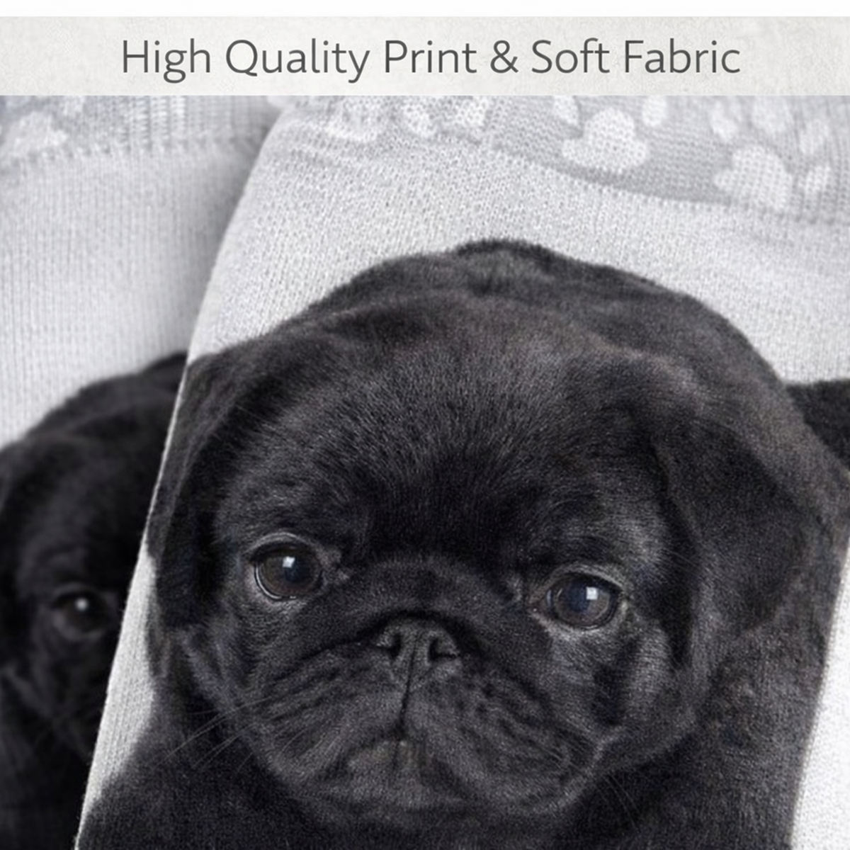 A close-up of a black pug puppy printed on a soft fabric, with a second puppy visible in the background and the text 'High Quality Print & Soft Fabric' across the top.