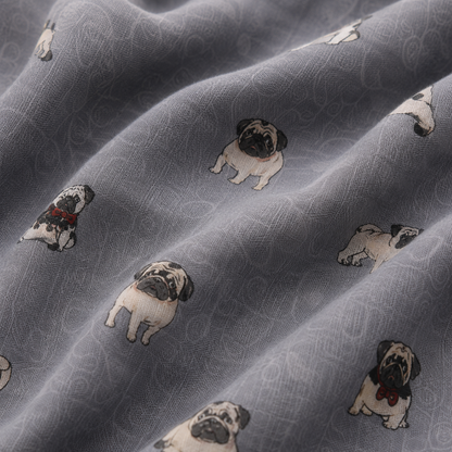 Grey patterned scarf with a repeating print of small pug dogs in black, brown white, and wearing red bows, shown in soft folds.